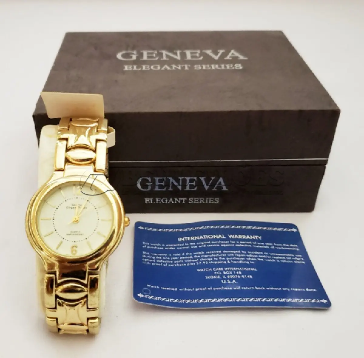 LOTE 325 - RELÓGIO MARCA GENEVA FUNCIONANDO NA CAIXA ORIGINAL.(NO ESTADO)