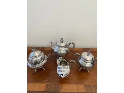 LOTE 037 - 01 CONJUNTO DE CAFÈ /CHÀ, EM PRATA PORTUGUESA. TODAS AS 4 PEÇAS TRABALHADAS. (NO ESTADO DE CONSERVAÇÃO QUE SE ENCONTRA)