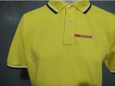 LOTE 234 - CAMISA POLO PRADA AMARELA LISA ORIGINAL TAMANHO MÉDIO (NO ESTADO)