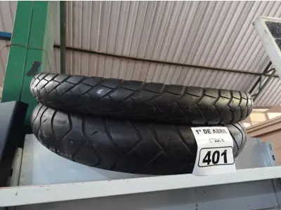 LOTE 401 - 02 PNEUS DE MOTO USADOS 80/90/21 E 110/80/19. (NO ESTADO) ATENÇÃO! FAZER A VISITAÇÃO ANTES DE ARREMATAR, NÃO SABEMOS SE FUNCIONA. LEILÃO NÃO TEM GARANTIA E NEM DEVOLUÇÃO, SUJEITO A POSSÍVEIS AVARIAS VISÍVEIS/OCULTAS E/OU AUSÊNCIA DE COMPONENTES.