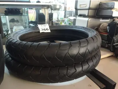 LOTE 366 - 02 PNEUS DE MOTO USADOS 120/70/19 E 90/90/21. (NO ESTADO) ATENÇÃO! FAZER A VISITAÇÃO ANTES DE ARREMATAR, NÃO SABEMOS SE FUNCIONA. LEILÃO NÃO TEM GARANTIA E NEM DEVOLUÇÃO, SUJEITO A POSSÍVEIS AVARIAS VISÍVEIS/OCULTAS E/OU AUSÊNCIA DE COMPONENTES.