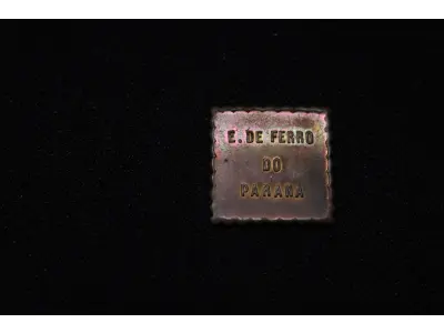 LOTE 038 - LOTE 38 – OBJETOS PECUNIÁRIOS CERÂMICA E FERROVIA ●	Fichas em cobre e alumínio, circulares; tendo na face o valor, no anverso, centralizado a figura de um pinheiro, dividindo ao as palavras MARCA REGIST, abaixo desta a inscrição CERAMICA DE PINHAES na orla, em circular com a inscrição "Pinhaes Paraná. Guilherme Weiss"  ●	Ficha de Fornecimento da Rede Ferroviária do Paraná 	OBJETO	OBSERVAÇÕES 1.		Ficha Cerâmica de Pinhaes - 100	Alumínio 2.		Ficha Cerâmica de Pinhaes - 100	Alumínio 3.		Ficha Cerâmica de Pinhaes - 100	Alumínio 4.		Ficha Cerâmica de Pinhaes - 100	Alumínio 5.		Ficha Cerâmica de Pinhaes - 100	Alumínio 6.		Ficha Cerâmica de Pinhaes - 200	Cobre 7.		Ficha de Fornecimentos da Rede Ferroviaria do PR - 50	Formato quadrado em metal estampado