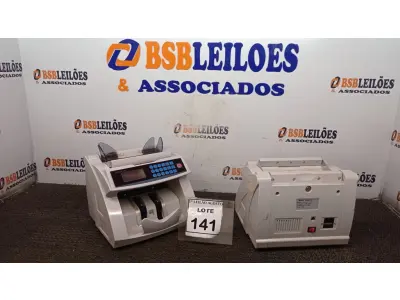 LOTE 141 - 02 MAQUINAS DE CONTAR CÉDULAS. (NO ESTADO) ATENÇÃO! FAZER A VISITAÇÃO ANTES DE ARREMATAR, NÃO SABEMOS SE FUNCIONA. LEILÃO NÃO TEM GARANTIA E NEM DEVOLUÇÃO, SUJEITO A POSSÍVEIS AVARIAS VISÍVEIS/OCULTAS E/OU AUSÊNCIA DE COMPONENTES.
