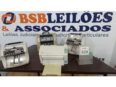 LOTE 329 - 03 MÁQUINAS DE CONTAGEM DE CÉDULAS E 01 IMPRESSORA. (NO ESTADO) ATENÇÃO! FAZER A VISITAÇÃO ANTES DE ARREMATAR, NÃO SABEMOS SE FUNCIONA. LEILÃO NÃO TEM GARANTIA E NEM DEVOLUÇÃO, SUJEITO A POSSÍVEIS AVARIAS VISÍVEIS/OCULTAS E/OU AUSÊNCIA DE COMPONENTES.