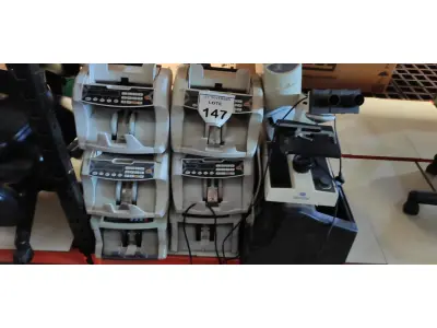 LOTE 147 - 01 MICROSCÓPIO INCOMPLETO, 02 ESTABILIZADORES, 01 MÁQUINA DE CONTAR MOEDAS E 06 MÁQUINAS DE CONTAR CÉDULAS. (NO ESTADO) ATENÇÃO! FAZER A VISITAÇÃO ANTES DE ARREMATAR, NÃO SABEMOS SE FUNCIONA, LEILÃO NÃO TEM GARANTIA E NEM DEVOLUÇÃO, SUJEITO A POSSÍVEIS AVARIAS VISÍVEIS/OCULTAS E/OU AUSÊNCIA DE COMPONENTES.