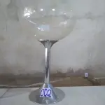 LOTE 002 - 01(UMA) CHAMPANHEIRA TAÇA ACRÍLICO TRANSPARENTE, COM BASE EM INOX TAMANHO GRANDE. (NO ESTADO).  
