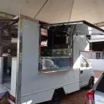 LOTE 473 - 01 CAMINHONETE I/RELY PICK-UP A GASOLINA NA COR PRATA; ANO 2013/2014.  CONSTA DÉBITO DE R$1319,24. (NO ESTADO)