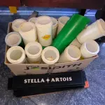 LOTE 265 - CAMISINHA PARA CERVEJA E PORTA CANUDO E TAPETE DE BAR. (NO ESTADO, NÃO SABEMOS SE FUNCIONA. LEILÃO NÃO TEM GARANTIA E NEM DEVOLUÇÃO).