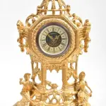 LOTE 202 - RELÓGIO DE MESA ALEMÃO, ANTIMÔNIO REVESTIDA A OURO, 38 CM DE ALTURA (NO ESTADO)