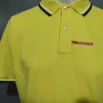 LOTE 234 - CAMISA POLO PRADA AMARELA LISA ORIGINAL TAMANHO MÉDIO (NO ESTADO)