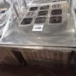 LOTE 130 - 01 BALCÃO INDUSTRIAL REFRIGERADO COM 09 CUBAS E 02 PASSADORES EM AÇO INOX. (NO ESTADO. LEILÃO NÃO TEM GARANTIA E NEM DEVOLUÇÃO).
