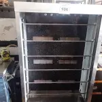LOTE 106 - 01 ASSADEIRA DE FRANGO PRO GÁS PARA 30 FRANGOS COM 06 ESPETOS FALTANDO 01 VIDRO EM AÇO INOX. (NO ESTADO, NÃO SABEMOS SE FUNCIONA.LEILÃO NÃO TEM GARANTIA E NEM DEVOLUÇÃO).