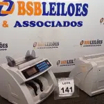 LOTE 141 - 02 MAQUINAS DE CONTAR CÉDULAS. (NO ESTADO) ATENÇÃO! FAZER A VISITAÇÃO ANTES DE ARREMATAR, NÃO SABEMOS SE FUNCIONA. LEILÃO NÃO TEM GARANTIA E NEM DEVOLUÇÃO, SUJEITO A POSSÍVEIS AVARIAS VISÍVEIS/OCULTAS E/OU AUSÊNCIA DE COMPONENTES.
