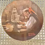 01 PRATO DE COLECIONADOR  "O CONSTRUTOR DE NAVIOS "THE SHIP BUILDER " DA ROYAL EATON NORMAN ROCKWELL, PRATO NUMERADO 11387 A PRATO NORMAN ROCKWELL DE 1980 "O CONSTRUTOR DE NAVIOS. EDIÇÃO LIMITADA  COM 21,5 CM DE DIÂMETRO, MULTICOLORIDO, COM DETALHES EM OURO 22 QUILATES. REPRESENTA UM VELHO E UM MENINO COM SEU CACHORRO OLHANDO PARA O MAR. SUPORTE DO PRATO NÃO ESTÁ INCLUÍDO. ITEM COMPRADO EM GARAGENS DE ANTIGUIDADES NOS EUA. (NO ESTADO) ATENÇÃO! FAZER A VISITAÇÃO ANTES DE ARREMATAR, NÃO SABEMOS SE FUNCIONA, LEILÃO NÃO TEM GARANTIA E NEM DEVOLUÇÃO, SUJEITO A POSSÍVEIS AVARIAS VISÍVEIS/OCULTAS E/OU AUSÊNCIA DE COMPONENTES.